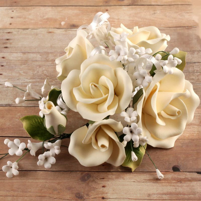 Yellow Gumpaste Sugar Rose Flower Spray cake decoration perfect as a cake topper when cake decorating rolled fondant wedding cakes, rolled fondant birthday cakes, rolled fondant custom cakes, and rolled fondant cupcakes. gumpaste rose