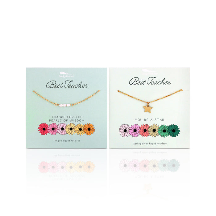 Two 'Best Teacher' necklace sets with different designs, pearls and a star, on light blue cards with floral graphics.