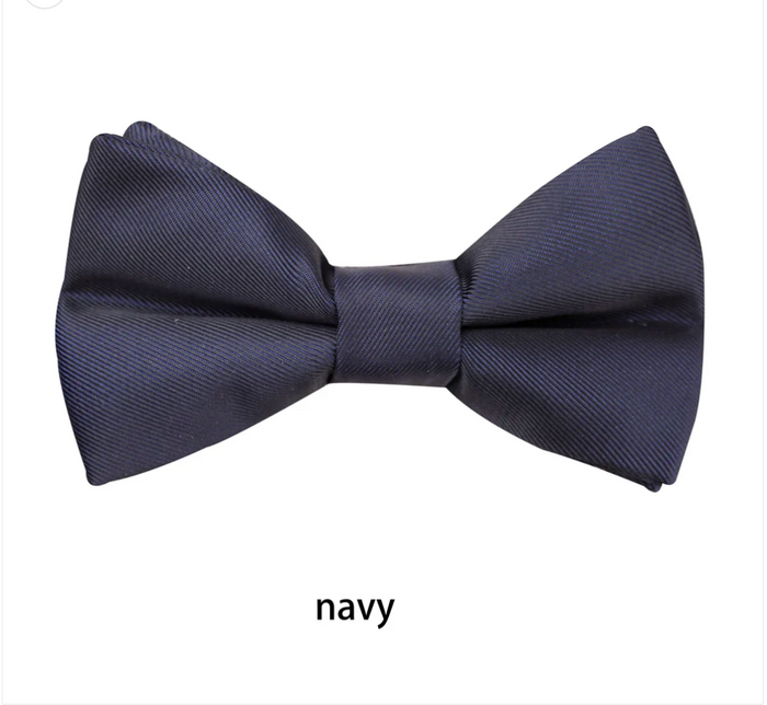 **Boys Matte Bow Tie**

Complete the perfect formal look with our classic Boys Matte Black Bow Tie. Featuring a sophisticated matte finish, it's the ideal accessory for weddings, school formals, page boys, black-tie events, and special occasions.

* Elegant matte finish for a modern look
* Bow measures **8.5cm** across
* Adjustable neck strap with a **full length of 45cm**
* Comfortable, secure fit
* A timeless finishing touch for every young gentleman

Smart, stylish, and easy to wear—an essent