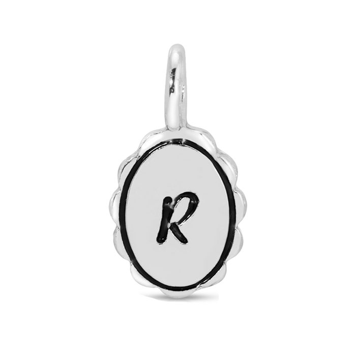 A silver charm pendant featuring the letter 'R' in black on a white oval background.