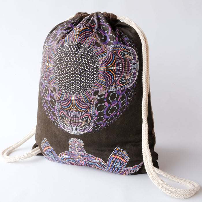 UV reactive drawstring bag glowing under blacklight - DMT HD design by Symbolika