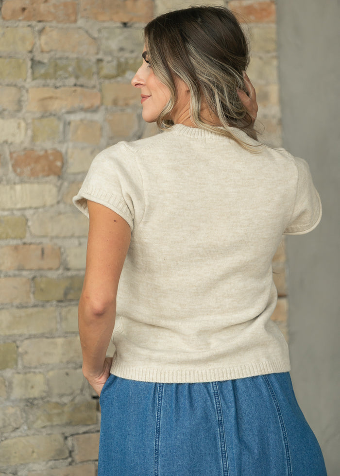 Back of Stone short sleeve sweater showing the soft knit and ribbed hem.