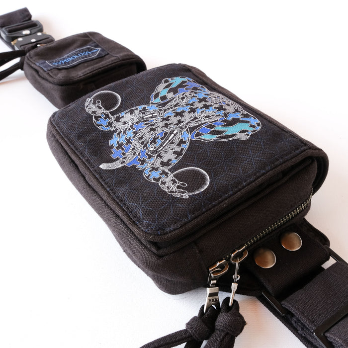 UV reactive Ganesha tessellation belt bag glowing blue under blacklight by Symbolika
