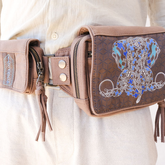 UV reactive Ganesha belt bag glowing blue-green under blacklight by Symbolika