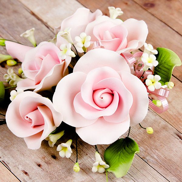 Garden Rose Sprays in Pink are gumpaste sugarflower cake decorations perfect as cake toppers for cake decorating fondant cakes and wedding cakes. Caljava wholesale cake supply.