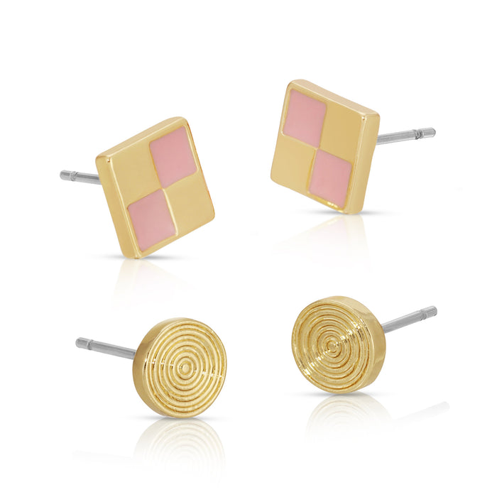 The image shows two pairs of gold stud earrings, one square with pink squares and the other circular with a spiral design.