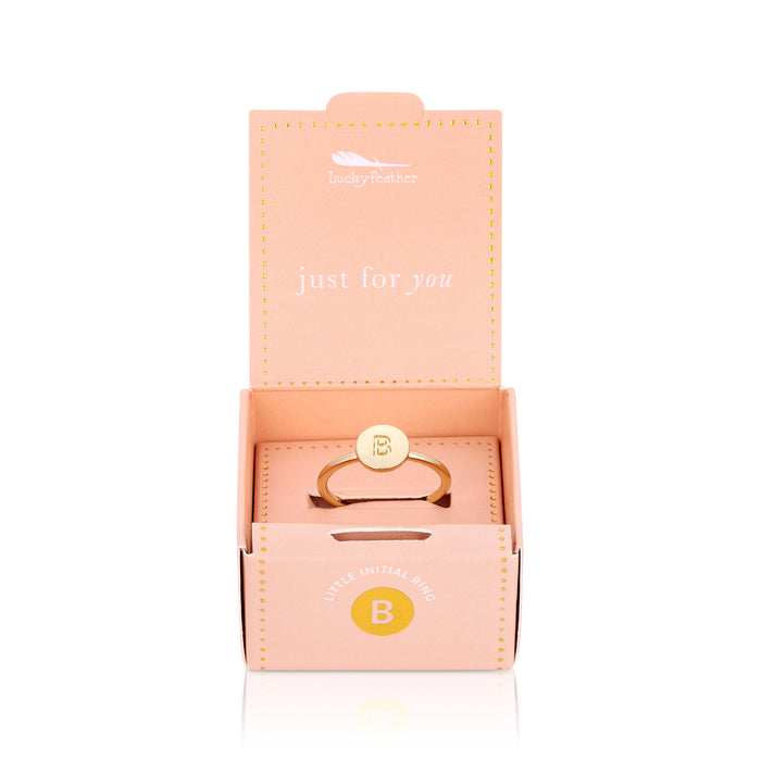 A 'Lucky Feather' gift box displays a gold ring with the initial 'B'.
