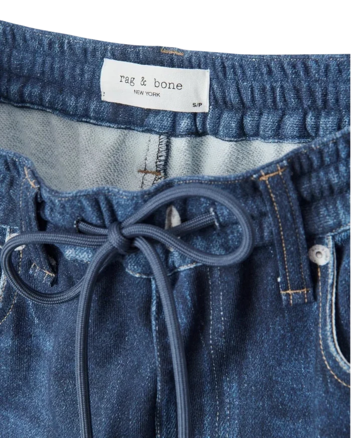 Wrabyn Miramar drawstring track pant in blue cotton terry with a denim-look print and elasticated waistband