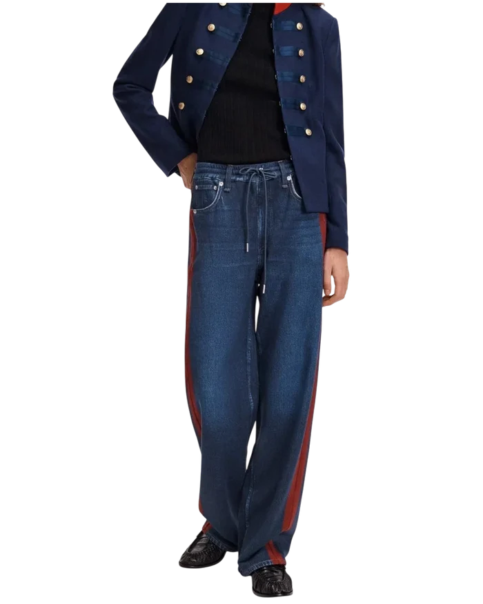 Wrabyn Miramar drawstring track pants in denim-print cotton terry with wide legs and sporty red side stripes.
