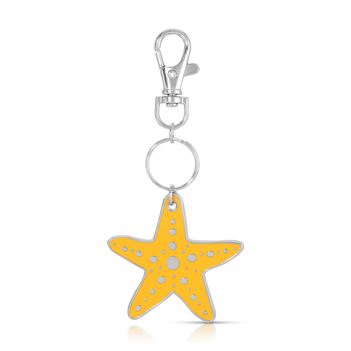 A yellow starfish keychain hangs from a silver clasp and ring.