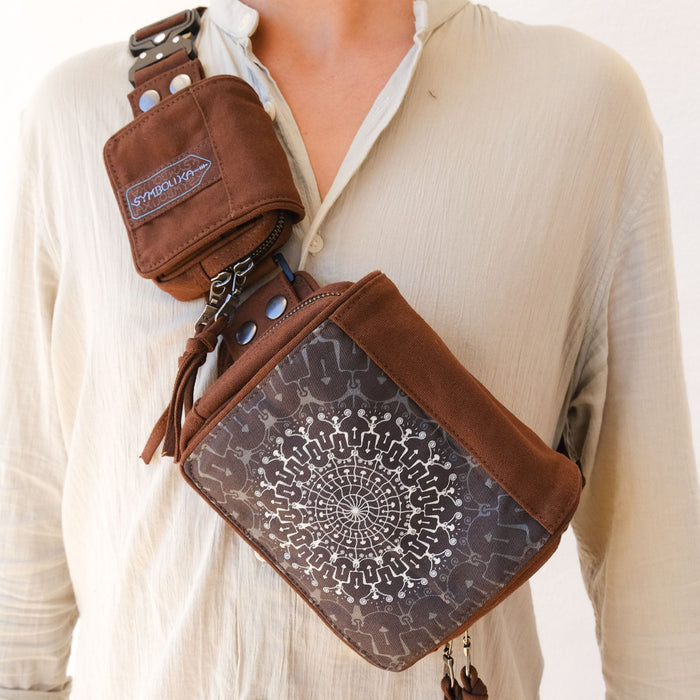 UV reactive mushroom mandala belt bag glowing under blacklight by Symbolika