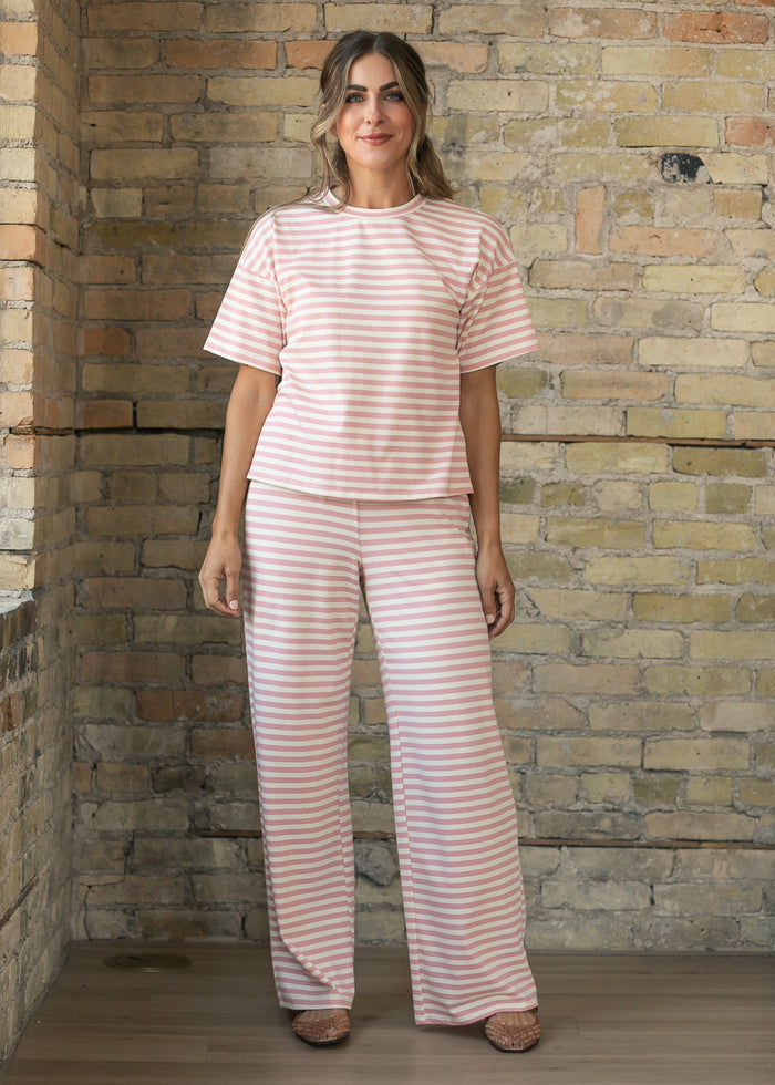 Pink striped wide-leg pants styled with the matching short sleeve tee.